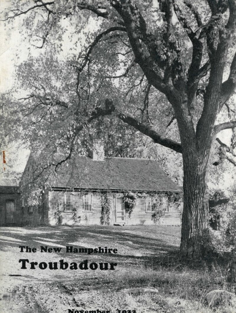 A rustic New England house partially obscured by a large spreading tree, with vine-covered facade, in a pastoral setting. Identified in the issue as the Reuben Thurston House at Madison.